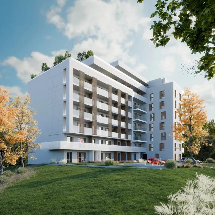 Nowoczesny budynek mieszkalny zrealizowany przez ED Invest w Warszawie, pokazujący standard wykończenia elewacji i zagospodarowania terenu wokół inwestycji.